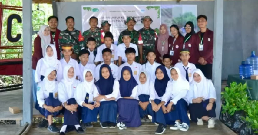 Leadership Camp students in school uniforms seated in rows with their facilitators.